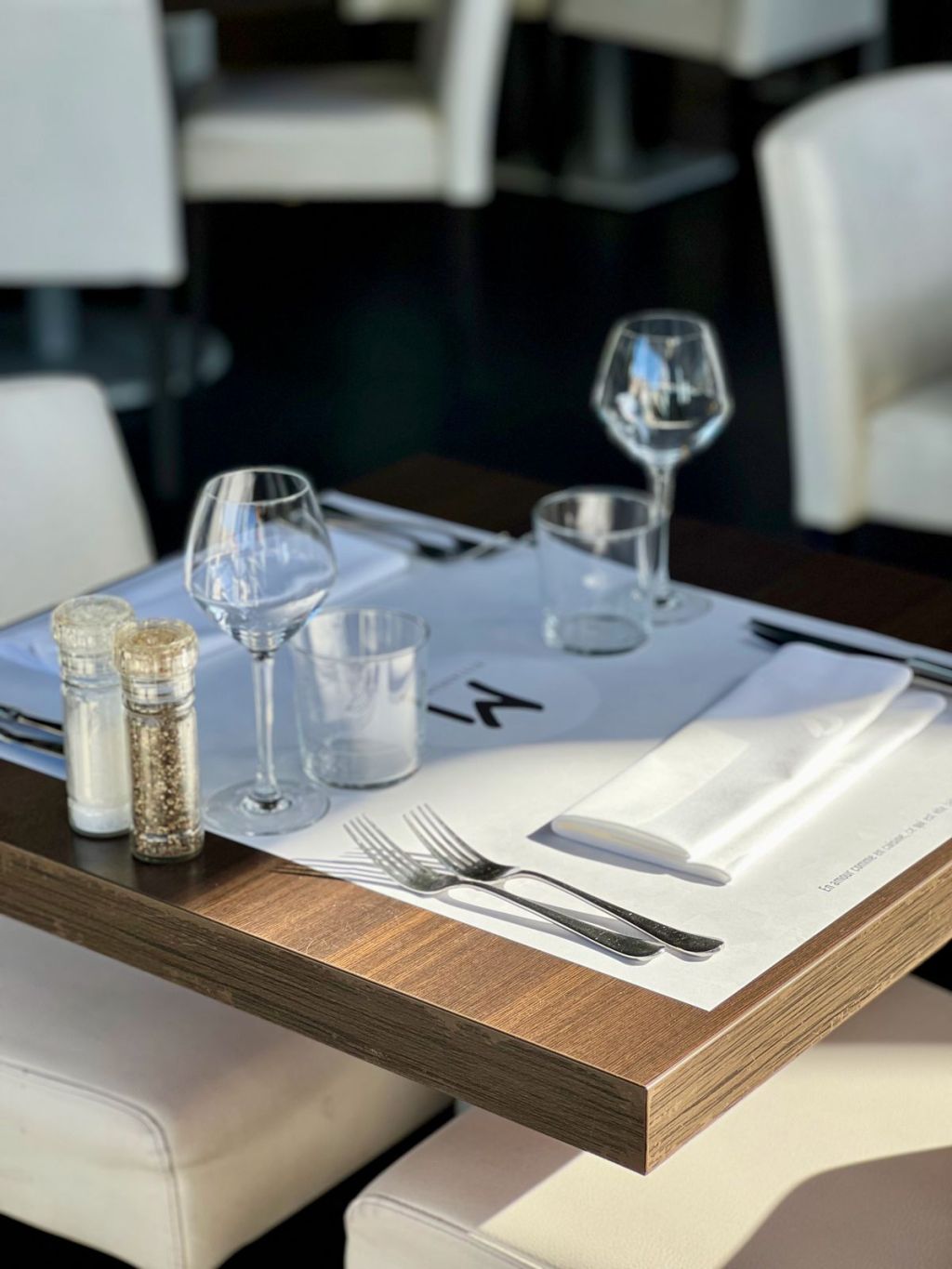 Sophisticated fine dining table setting with glassware.